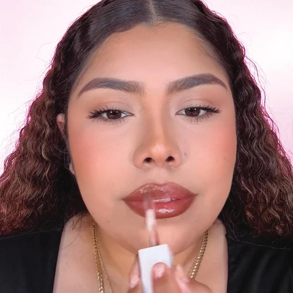 Using applicator, line lips and use single strokes to fill in lips completely.